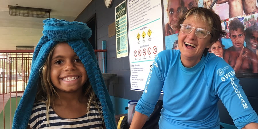 young aboriginal girl in Warburton with visiting swimming instructor Diana Papenfus