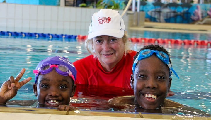 Swimming instructor Gayle Cruden with two students