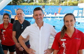Two lifeguards with two patrons by the pool at Craigie Leisure Centre