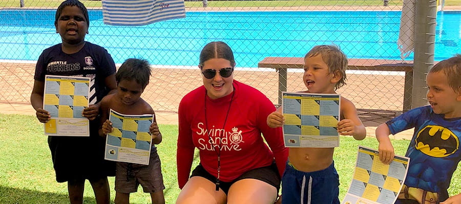 Swim instructor Zoe Ross with Fitzroy Crossing students