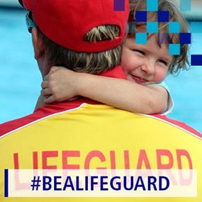 A lifeguard and a young child near a swimming pool
