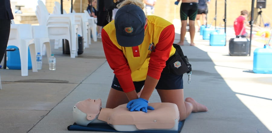 A lifeguard resuscitating a casualty