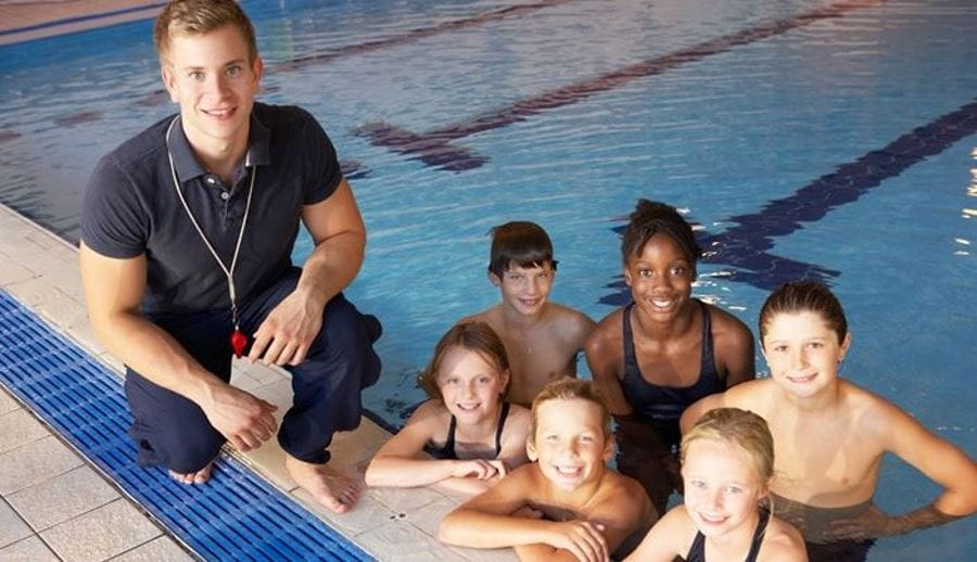 Swim instructor with children