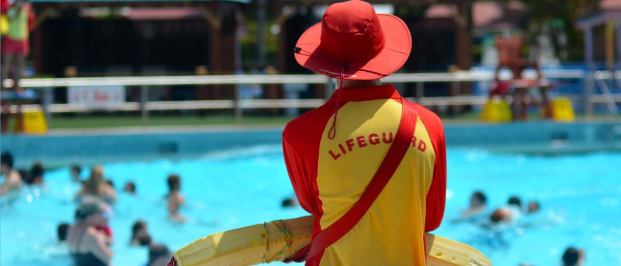 lifeguard scanning busy pool