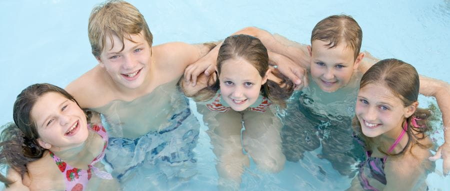 Smiling children in the pool