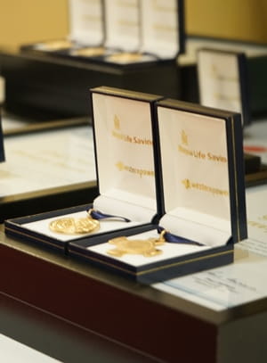 Image of bravery award medals in display boxes