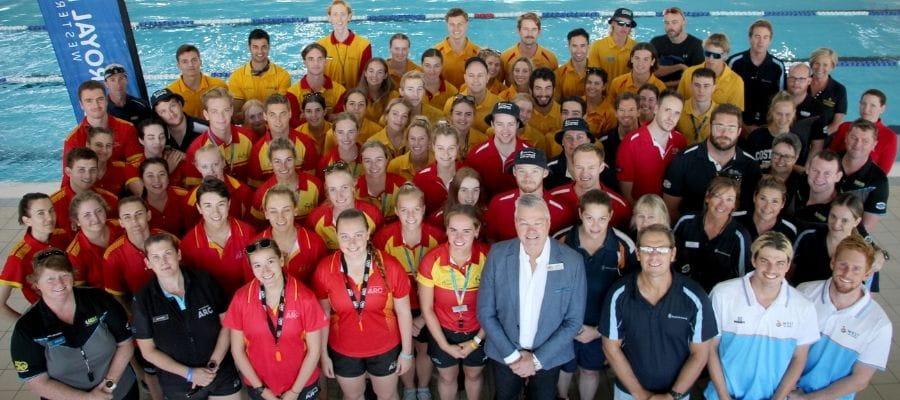 Pool Lifeguards performing CPR, swimming and walking with rescue tubes