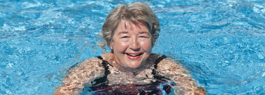 An older woman in the swimming pool