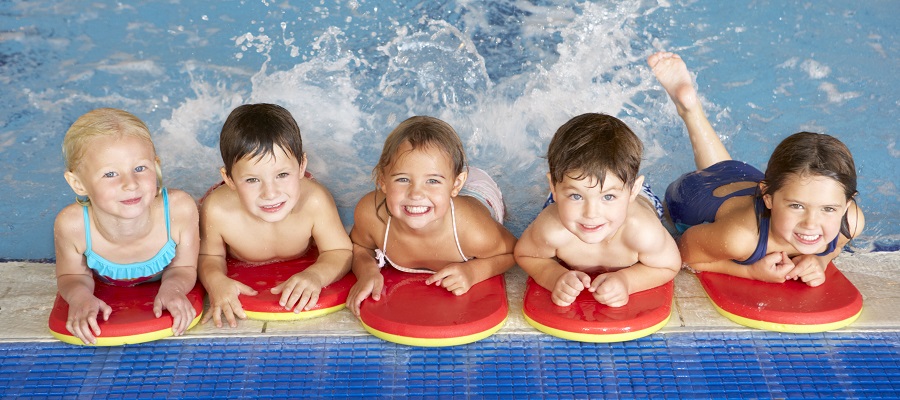 five children attending a swimming lesson
