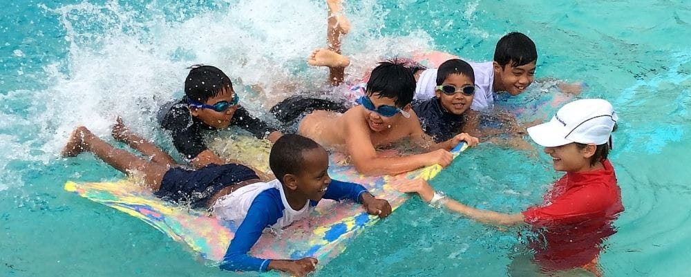 swimming instructor busy with her class