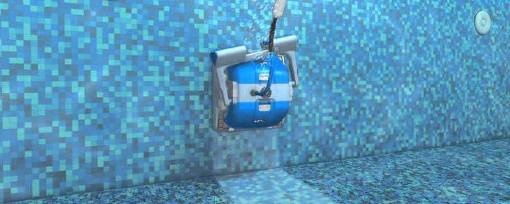 image of robotic pool cleaner climbing the wall of a pool
