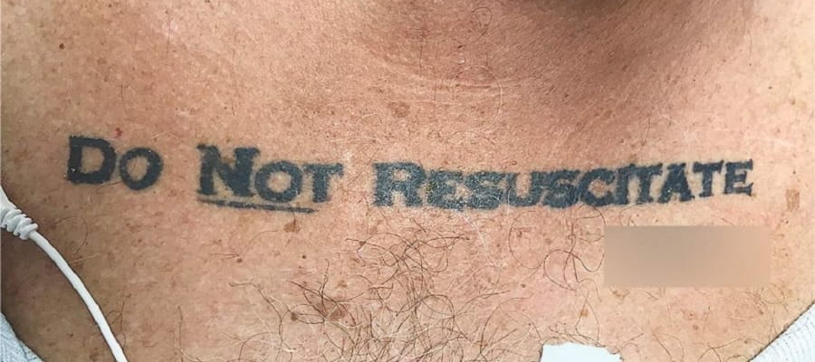tattoo on man's chest reading Do Not Resuscitate