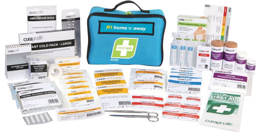 An image of a first aid kit with all the first aid items lined up around the kit