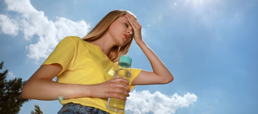 young woman suffering heat exhaustion